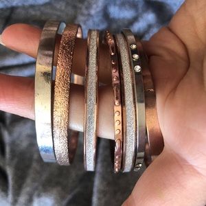 bundle of silver and rose gold bangles